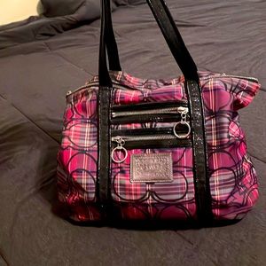 I’m selling a coach purse that has a couple of pink purple-ish type of colors